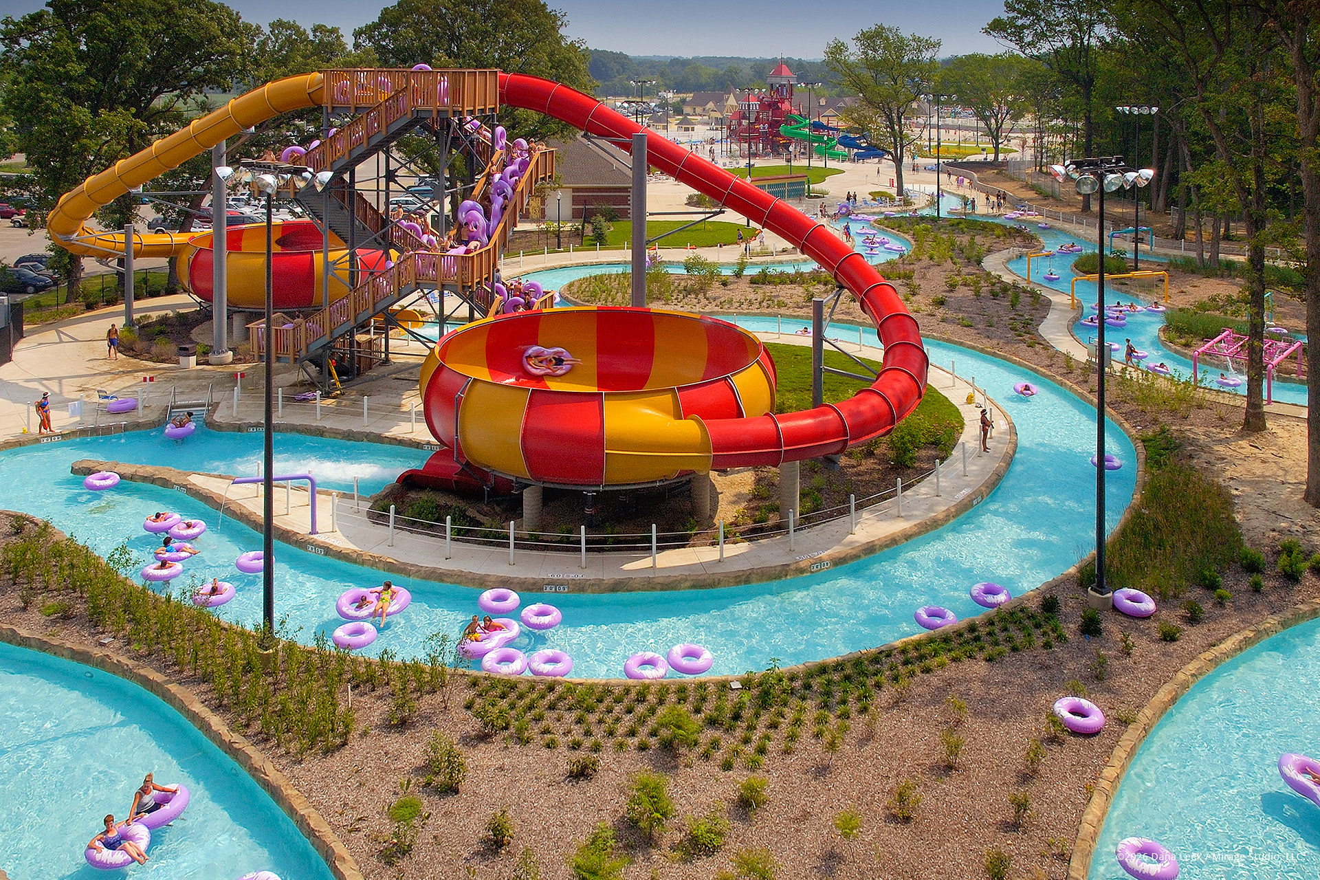 Aerial view of the Double Dueling CannonBowl slides at Deep River Waterpark, with riders spinning through the