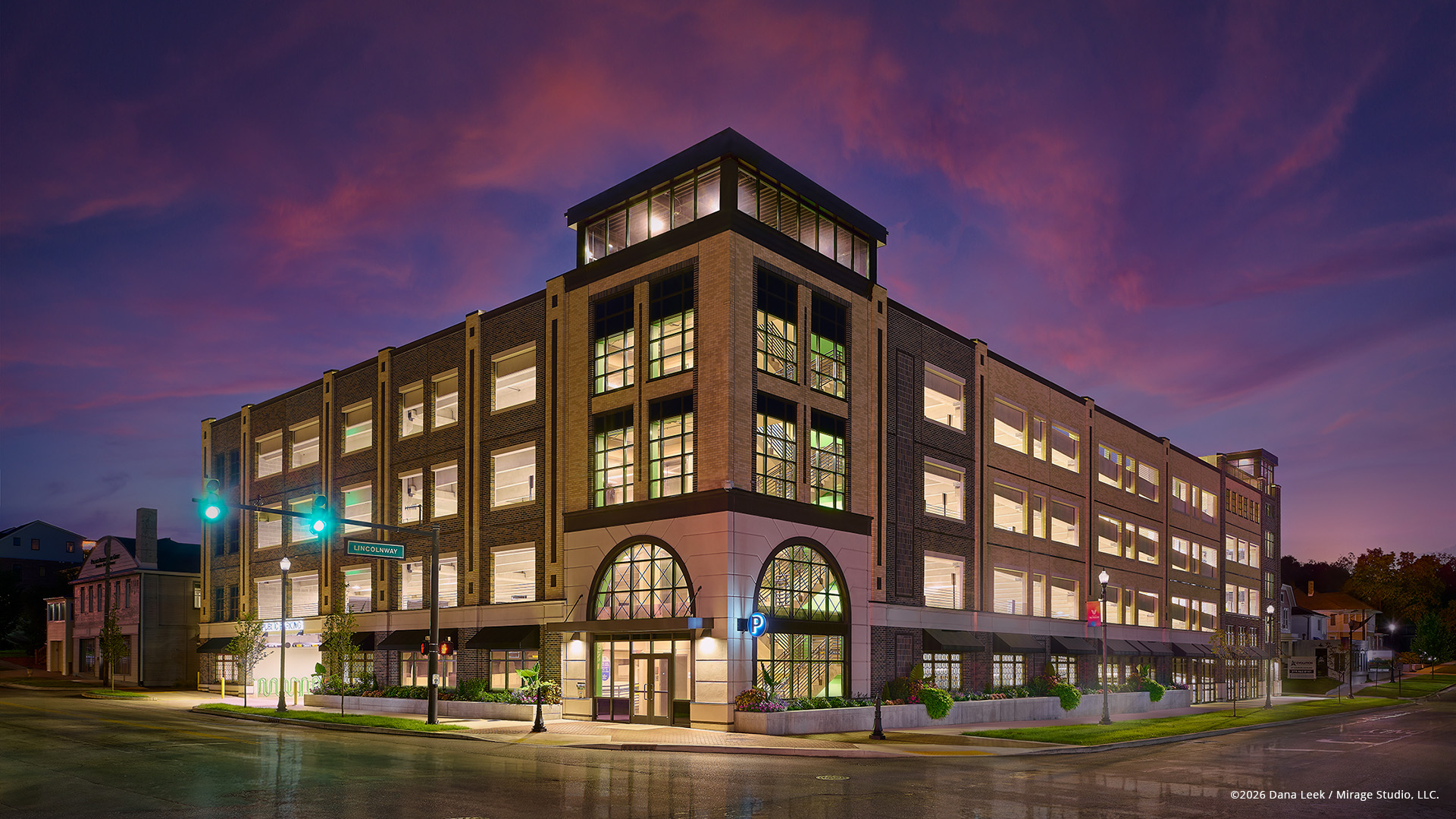 Architectural exterior photo of Valpo Parking at dusk showcasing detailed façade lighting